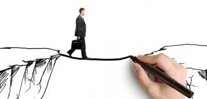 איש הולך על איור של גשר בין שני צוקים, המצוייר תוך כדי הליכתו